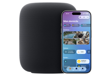 Un HomePod minuit placé à côté d’un iPhone montrant la vue Mon domicile de l’app Domicile.