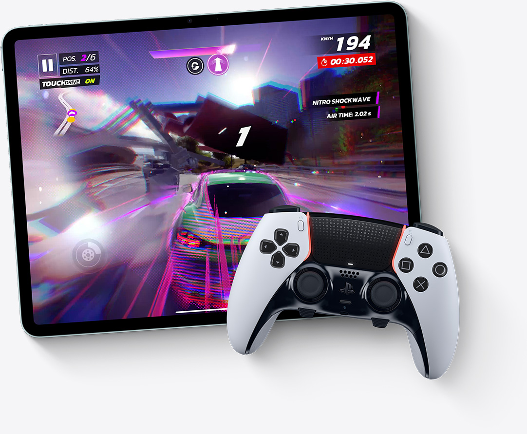 iPad Air, landscape orientation, screen displays video game Asphalt Legends Unite, PlayStation controller