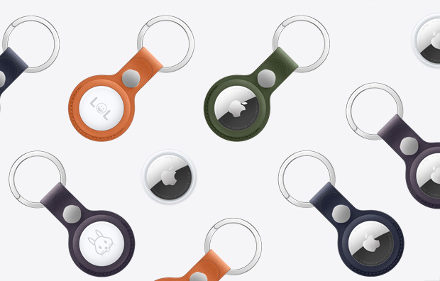 An array of AirTags and AirTags with FineWoven Key Ring in various colors including Orange, Dark Green, Deep Blue, Blackberry, and Black