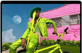 MacBook Air screen showing photo of person in colorful outfit, demonstrating color range and resolution of Liquid Retina display