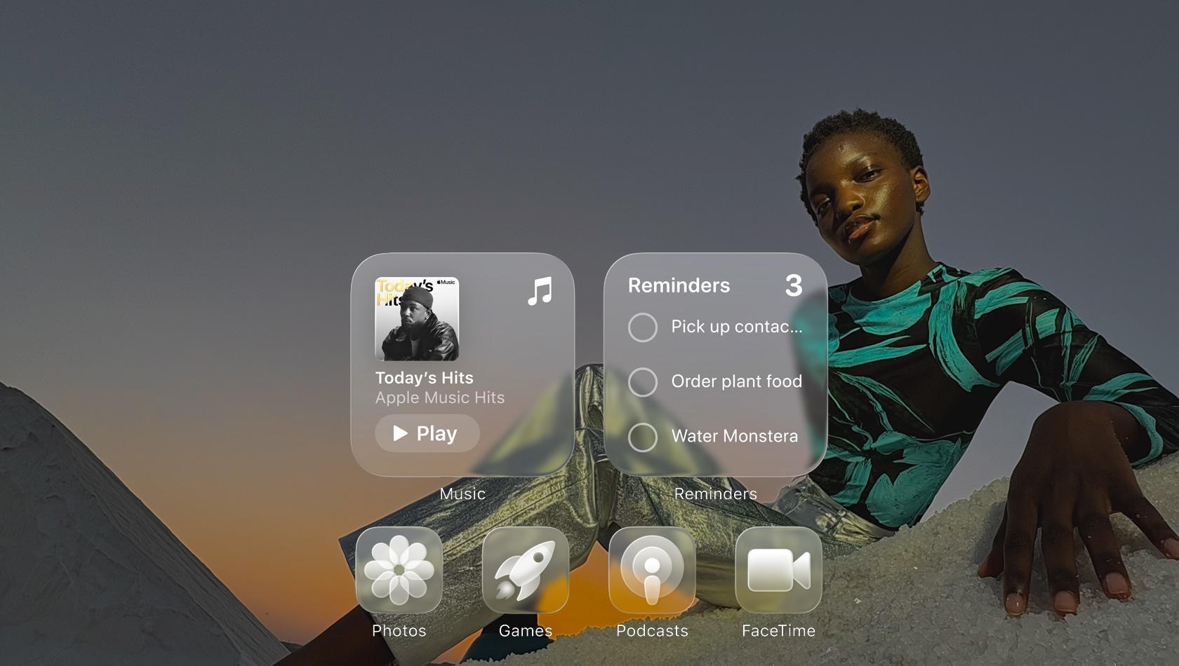Liquid Glass display with clear app icons, like Apple Music, Reminders, Photos, Games, Podcasts, and FaceTime refracting against the wallpaper