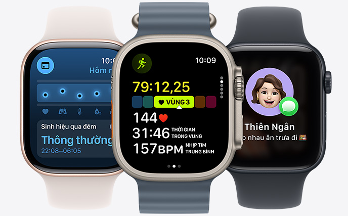 Ba phiên bản Apple Watch, ở giữa là phiên bản màu Tự Nhiên, mặt đồng hồ hiển thị bài tập chạy đang diễn ra cùng với số liệu nhịp tim, bên phải là phiên bản màu Đen Bóng, mặt đồng hồ hiển thị Genmoji, bên trái là phiên bản màu Vàng Hồng, mặt đồng hồ hiển thị Sinh Hiệu